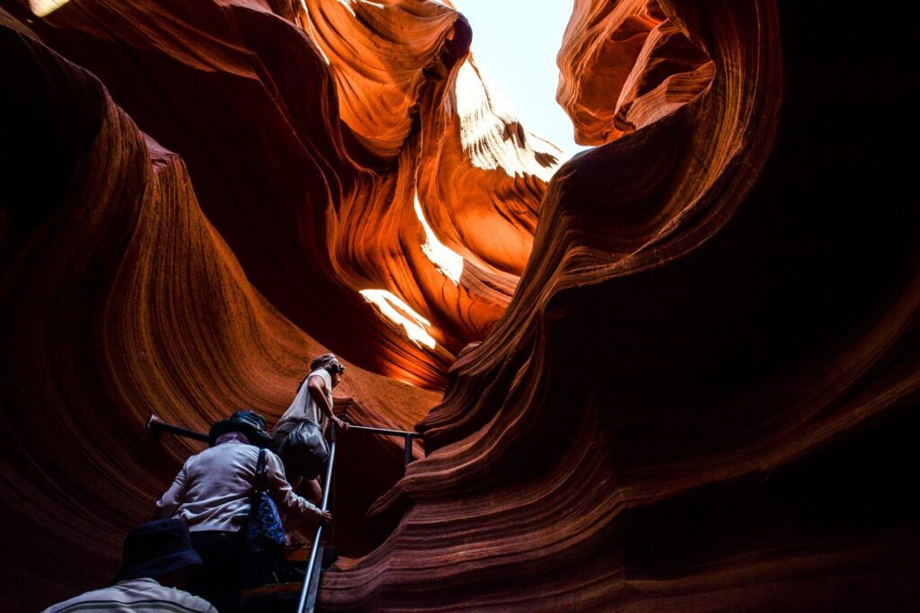 People climbing up stairs out of Antelope Canyon