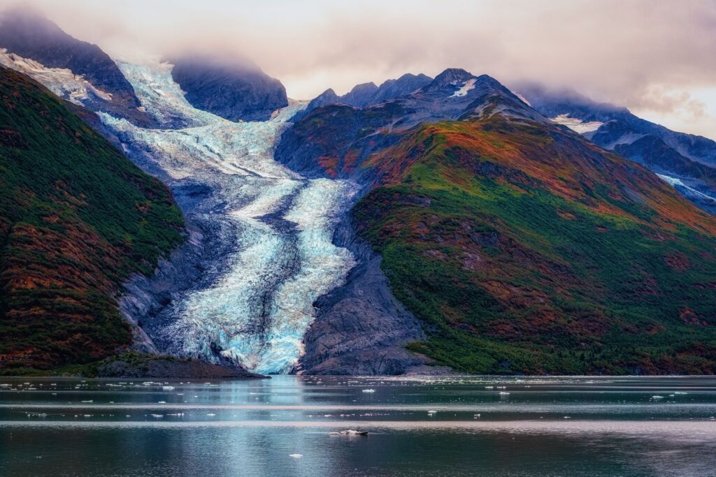 view of a glacier sound along a coastline on a mountain