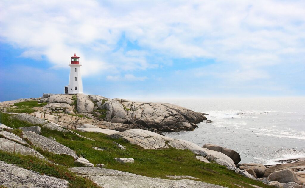 lighthouse on rocks looking out to the ocean