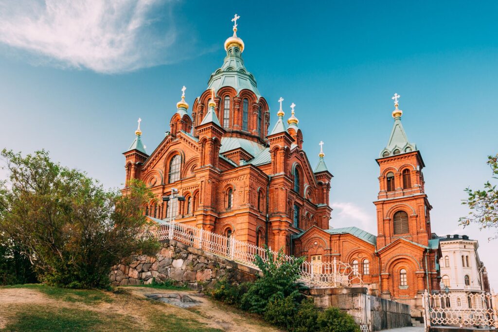 Uspenski Orthodox Cathedral Upon Hillside On Katajanokka Peninsula Overlooking City Church Of Red Brick In Summer Sunny Day