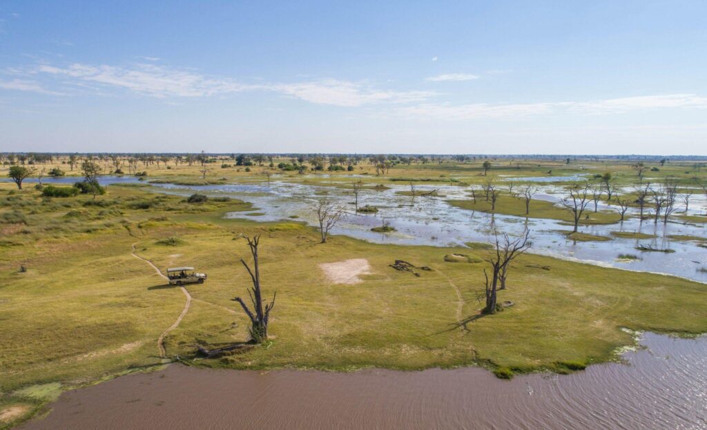 safari drive amongst savannah and water