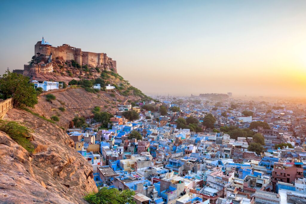 Mehrangarh Fort rising over a blue city