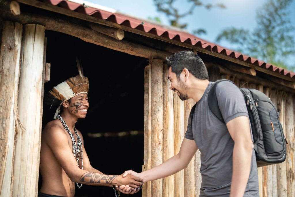 Indigenous Brazilian Young Man Portrait from Guarani ethnicity, Welcoming the tourist