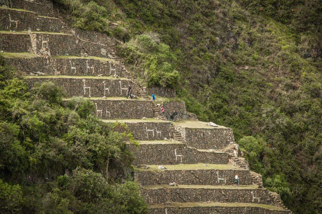 people walking up steep steps