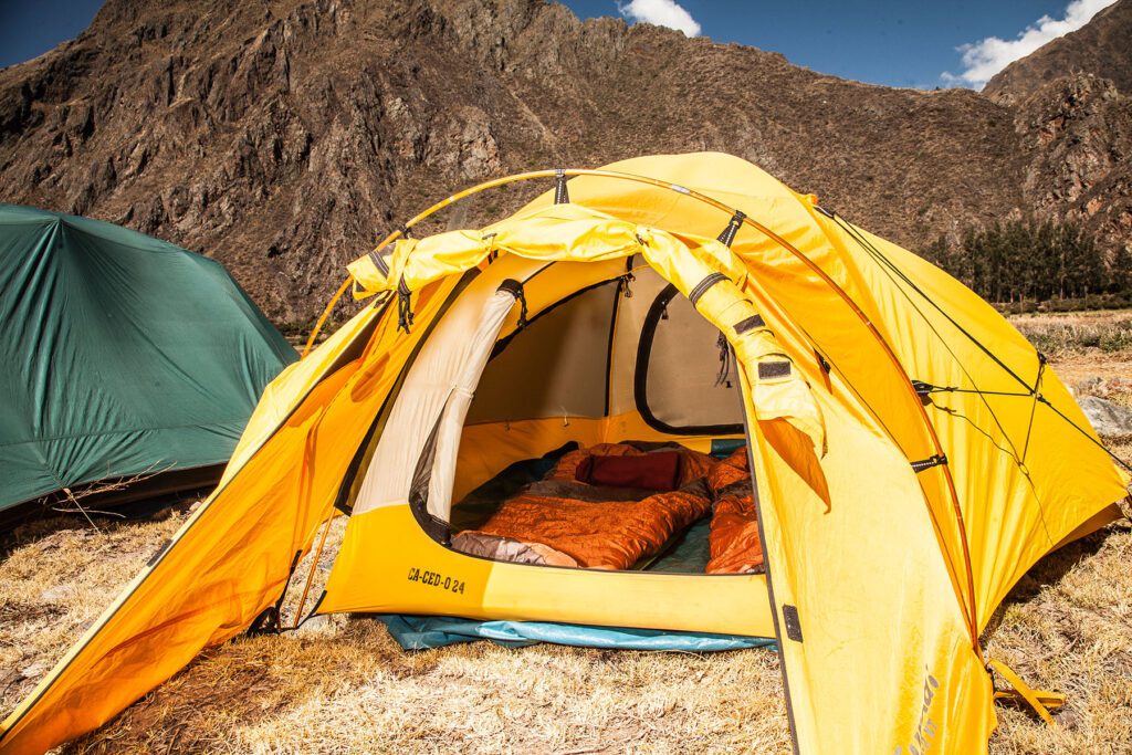 A tent set up along the trail