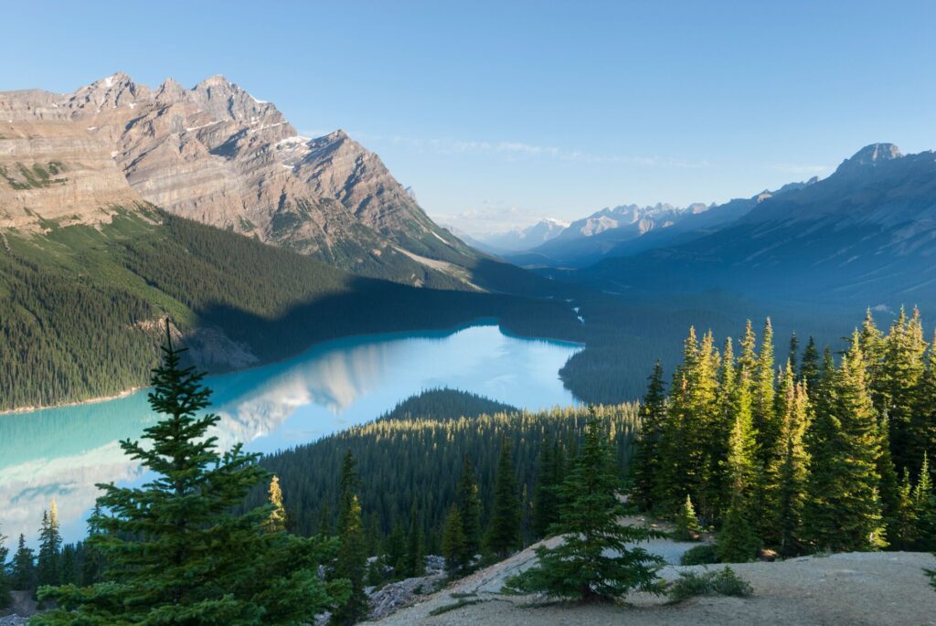 lake under a mountain with a forest in canada
