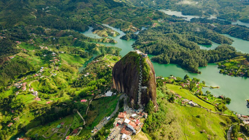 El Peñol de Guatape, tall peak with stairs leading up the side.