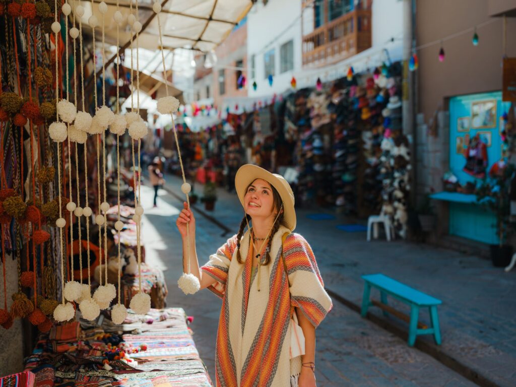 Pisac Market - Woman choosing souvenirs