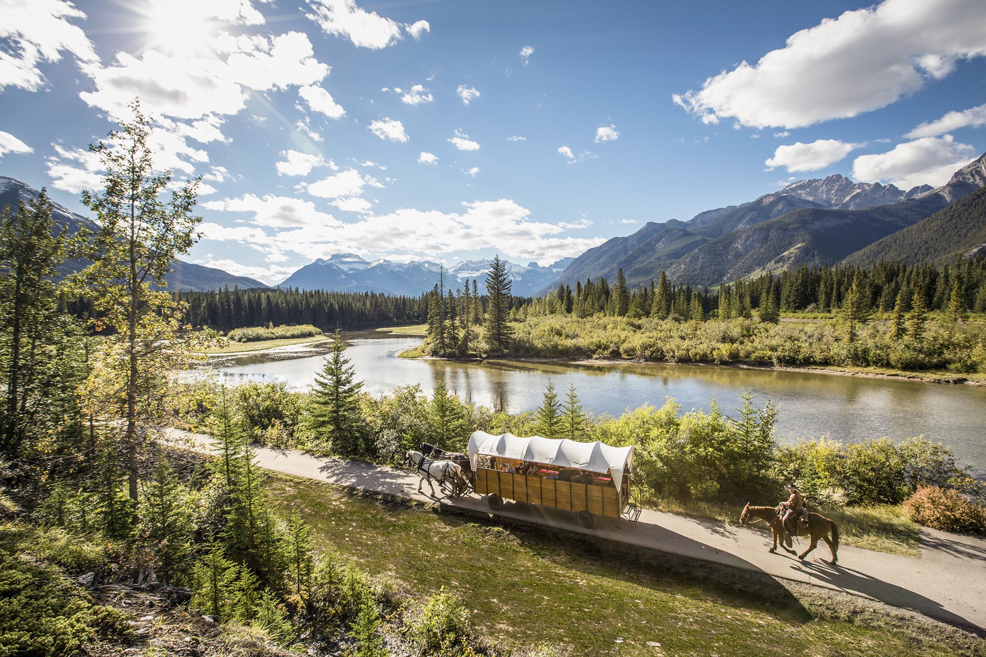 People riding horses in the mountains