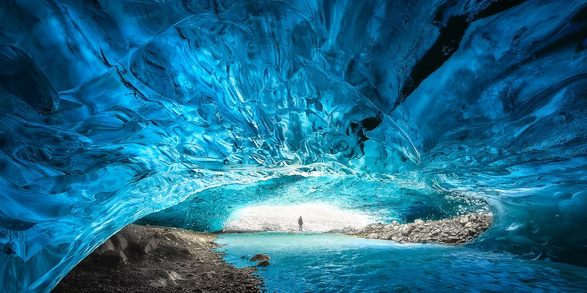 Iceland Vatnajökull National Park Person Shown Deep In Sapphire Blue Ice