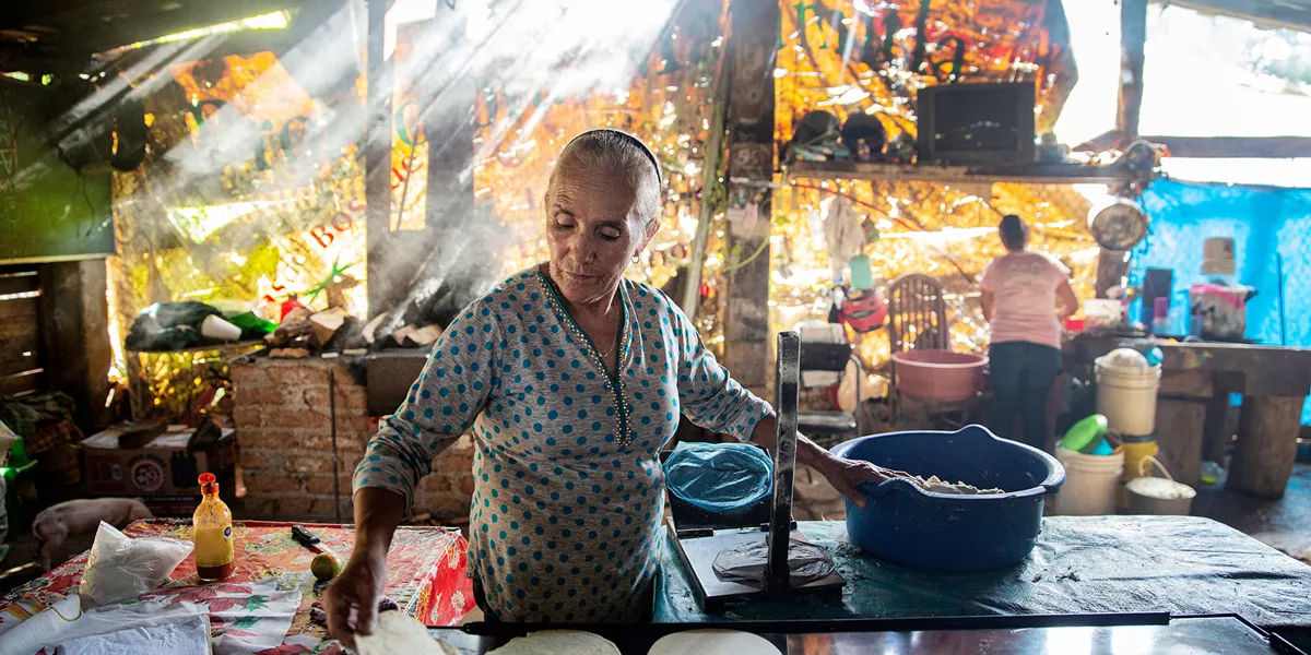 Woman making traditional tortillas