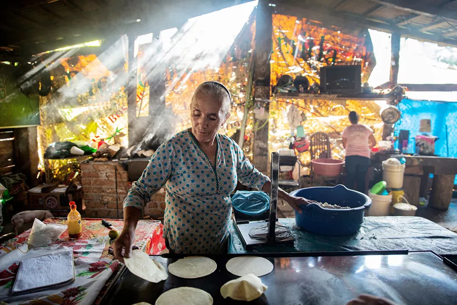 Woman making traditional tortillas