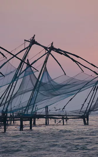 A group of fishing nets sitting on top of a body of water