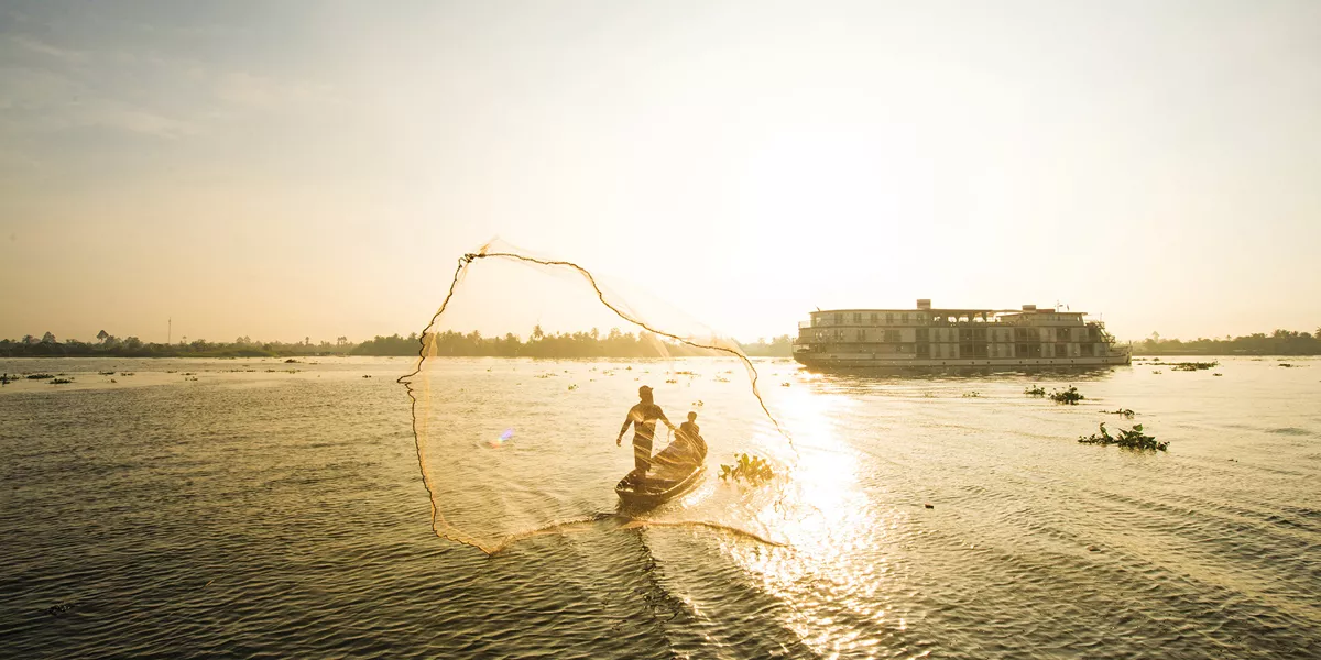 ship exterior with fisherman out on the river