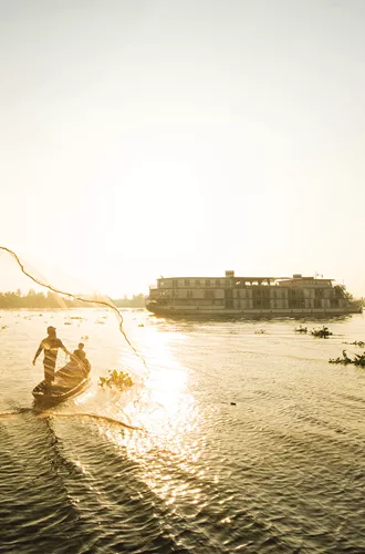 ship exterior with fisherman out on the river