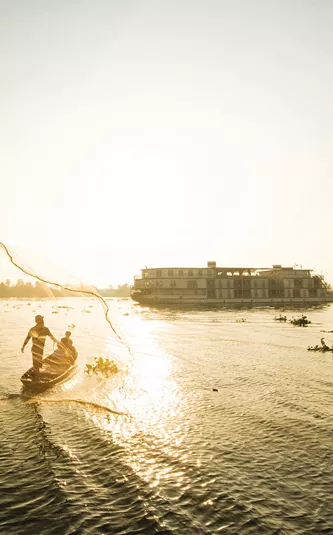 ship exterior with fisherman out on the river