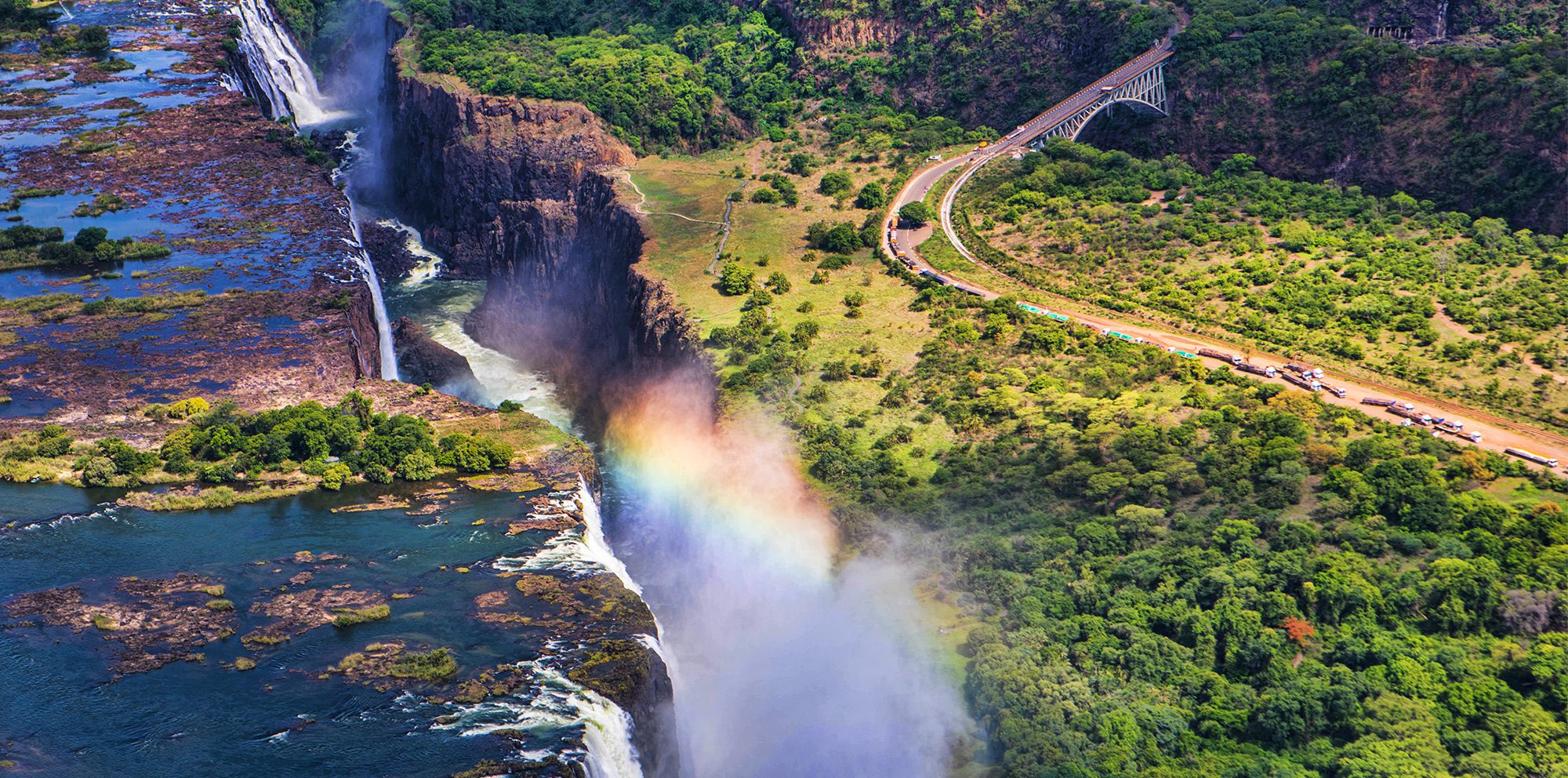 Victoria Falls with a rainbow in the middle of it 