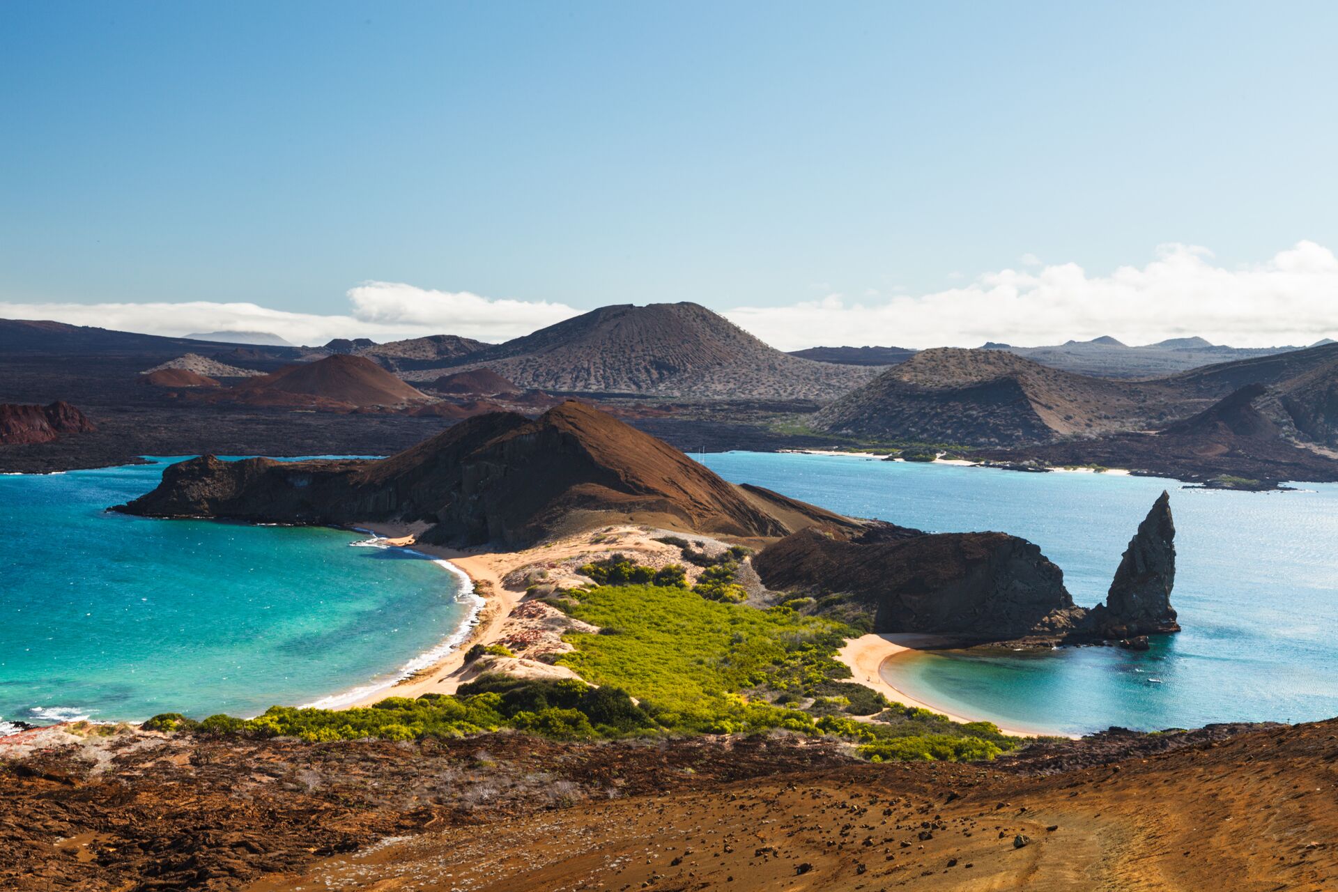 View On The Volcanic Landscape Of Bartolome Island With Famous Pinnacle Rock And Golden Beach