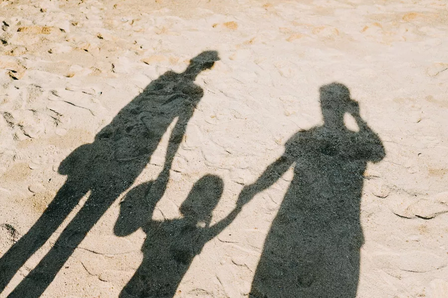 Family Shadow On Sandy Beach