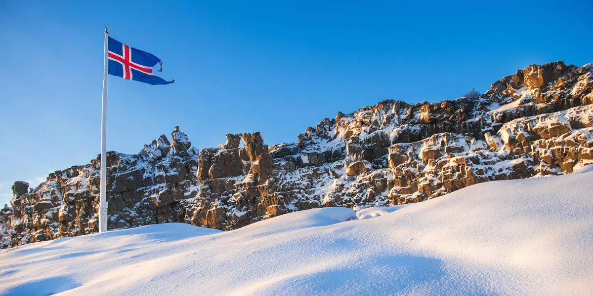 Icelandic flag flying in wintery Thingvellir National Park