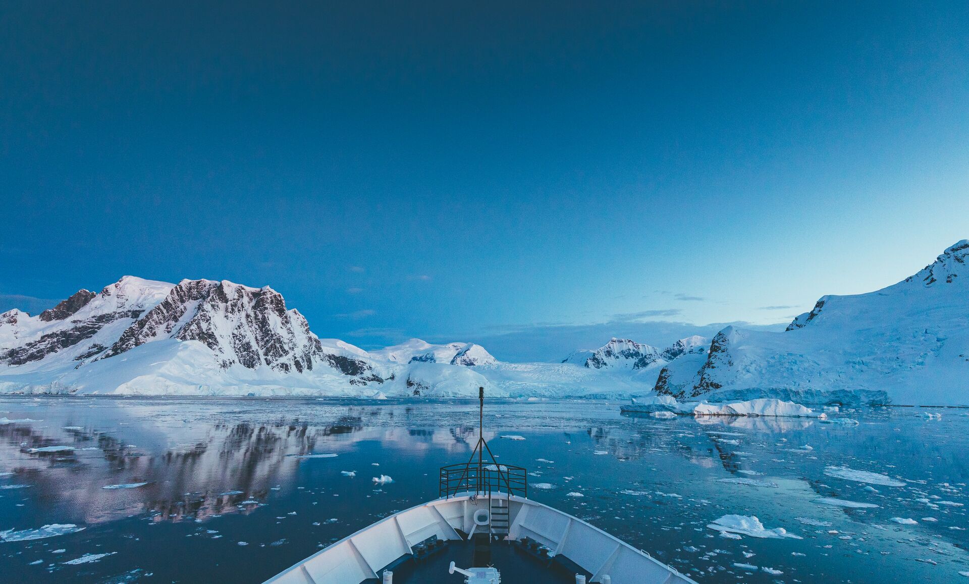 looking off the front of a ship at antarctic peninsula