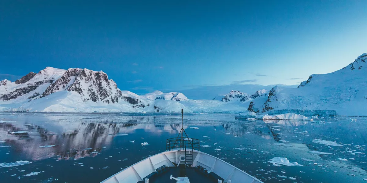 looking off the front of a ship at antarctic peninsula