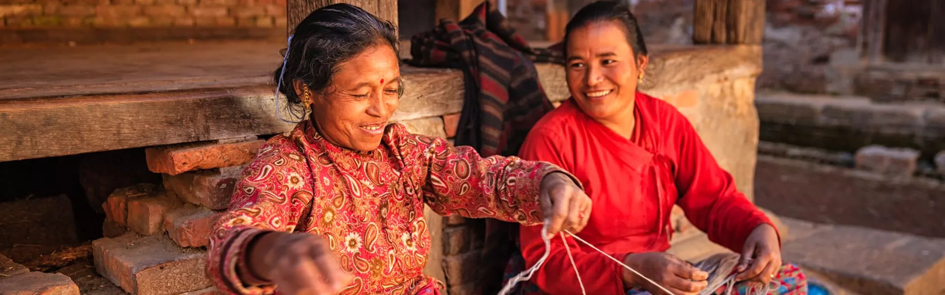 Two Nepali Women Spinning Wool