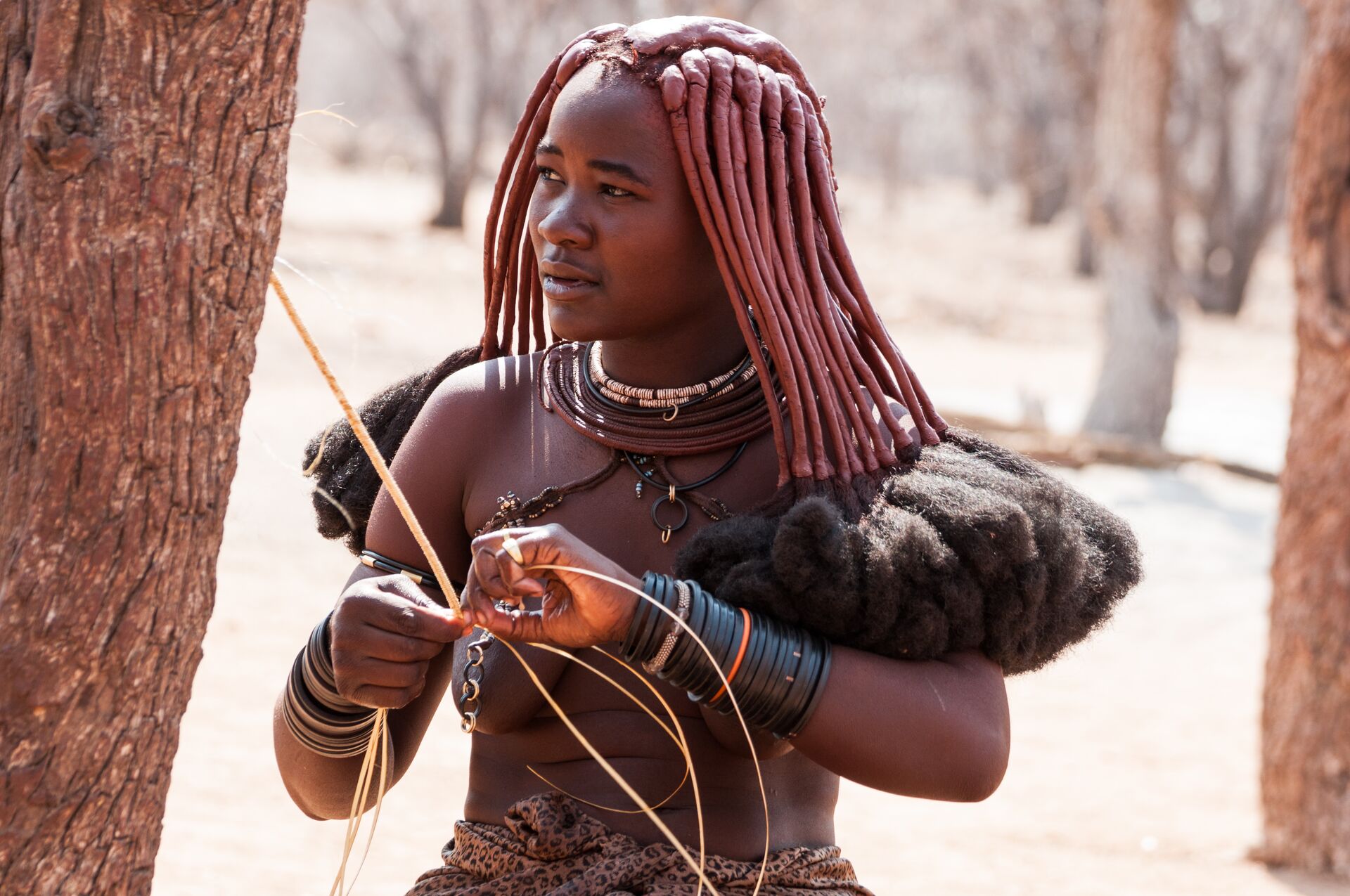 Namibia Himba Woman Weaving Fibers