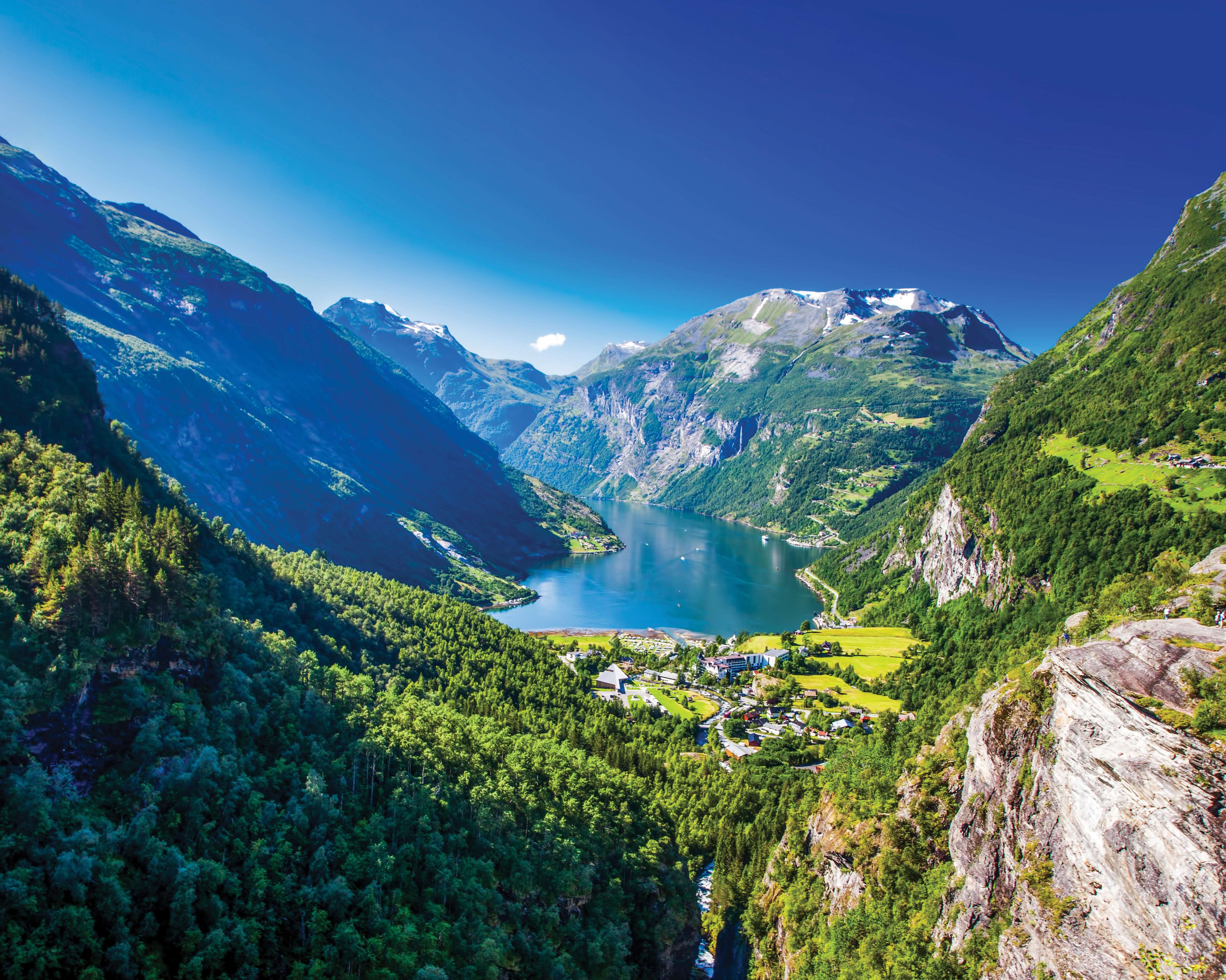A lake surrounded by mountains in Geirangerfjord in Norway