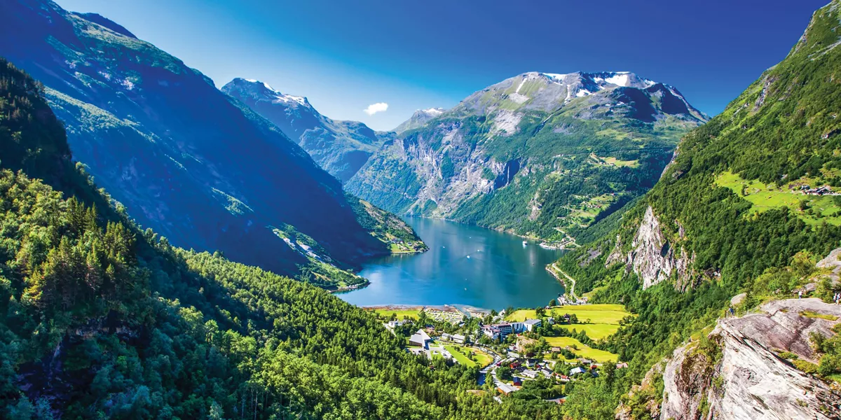 A lake surrounded by mountains in Geirangerfjord in Norway