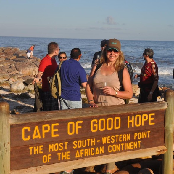 Woman in front of sign that says Cape of Good Hope