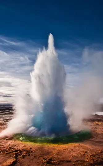 Strokkur Geyser shooting water into the air