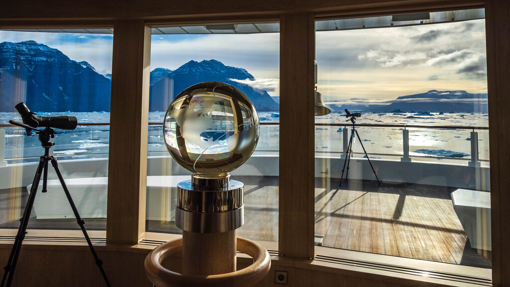 Crystal Globe And Spotting Scope In The Observation Lounge On The Ship National Geographic Endruance