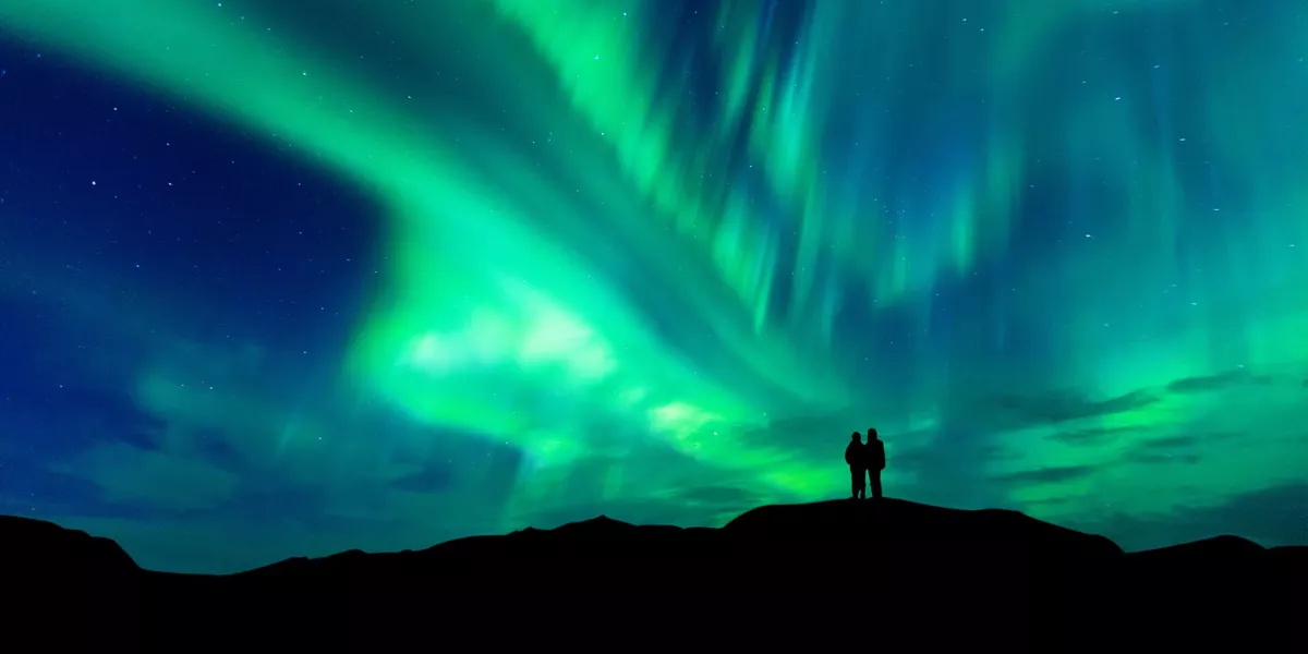 couple looking at northern lights