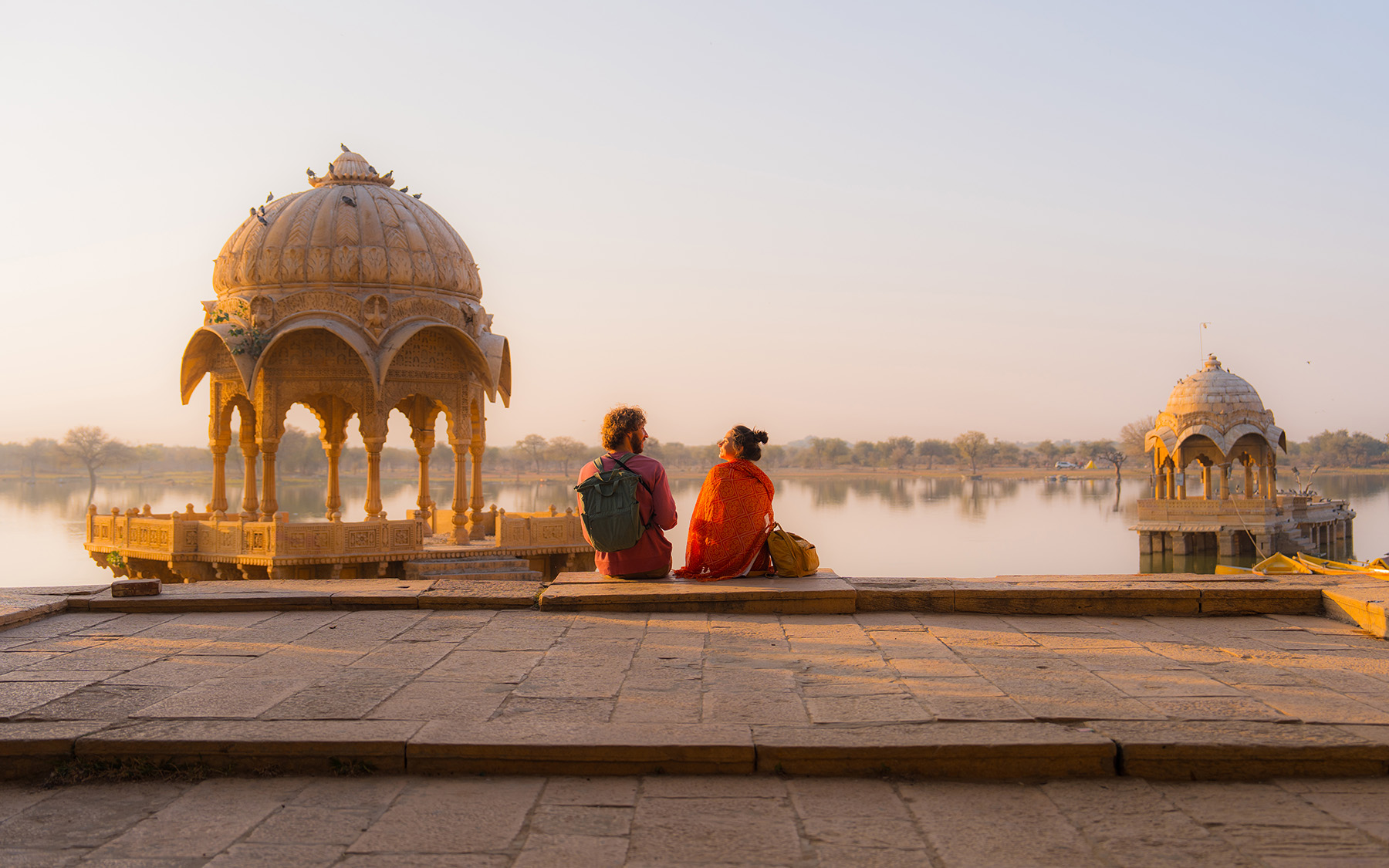India Jaisalmer Man And Woman Enjoying Scenic Sunset At Gadisar Lake