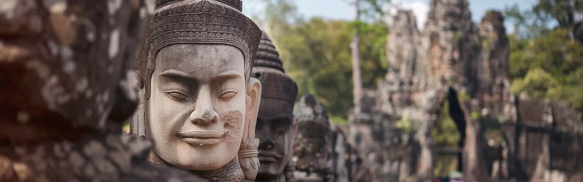 A row of buddha statues in Angkor Wat