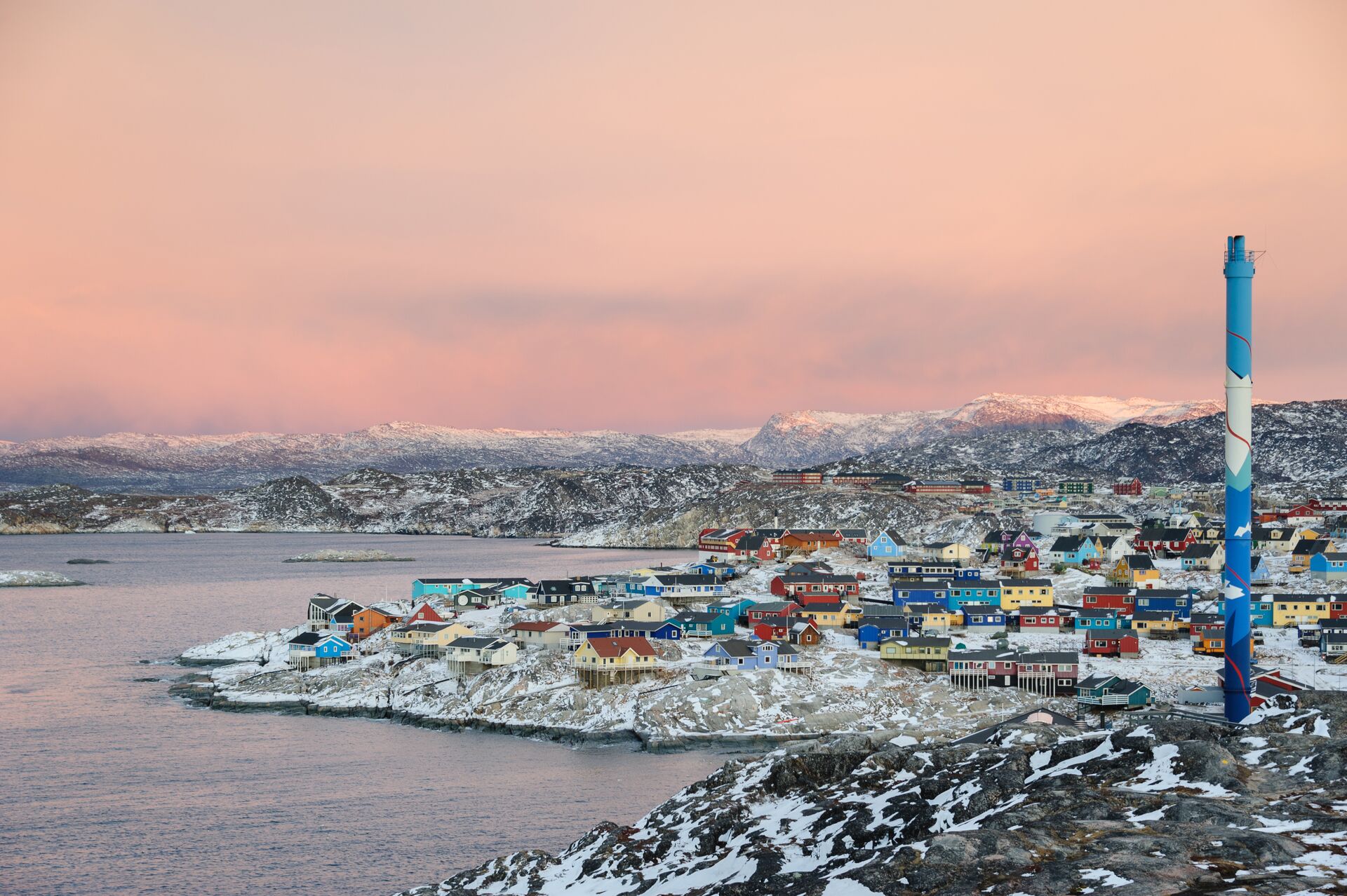 Town on the coast in arctic region at sunset