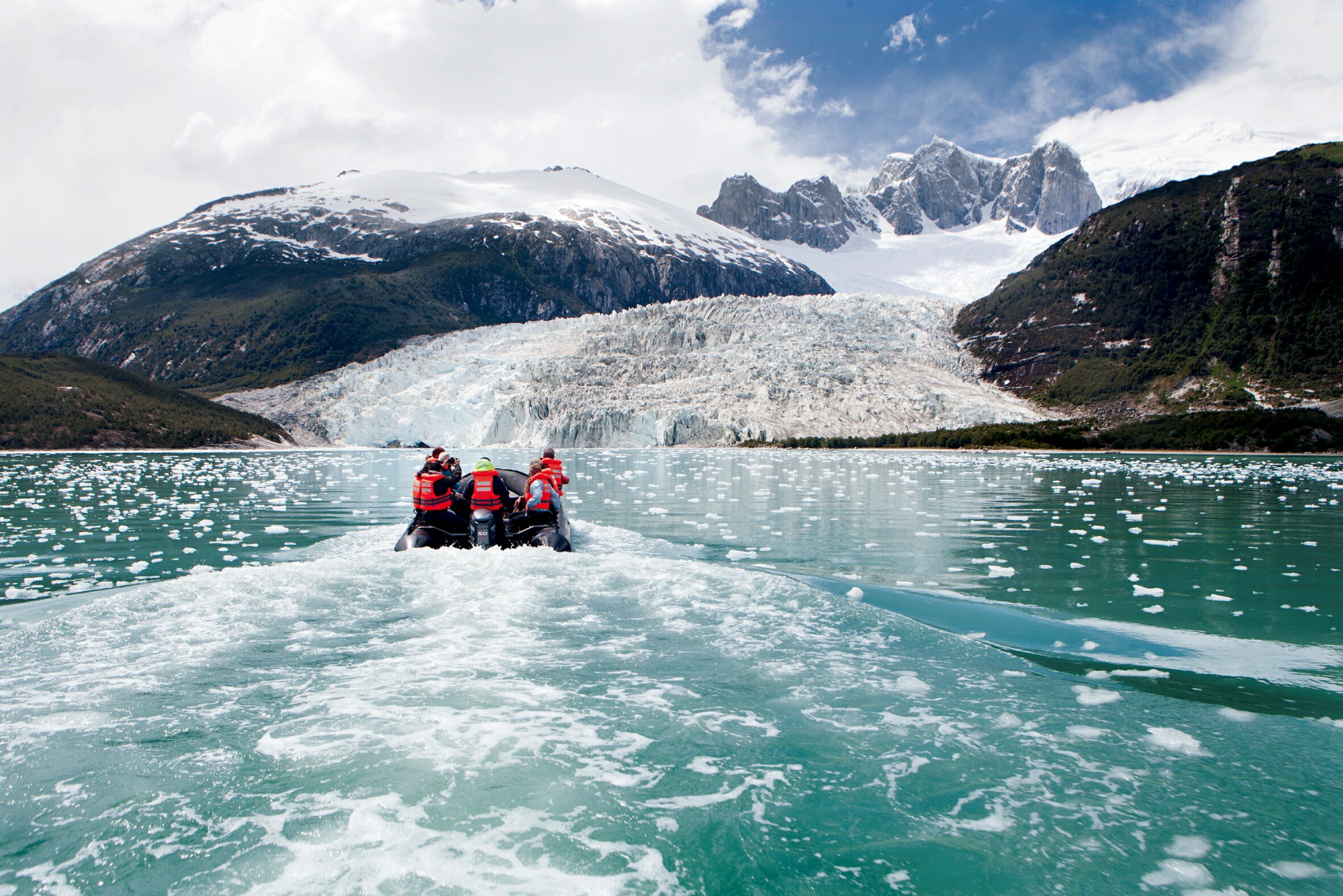 A group of people riding on the back of a boat