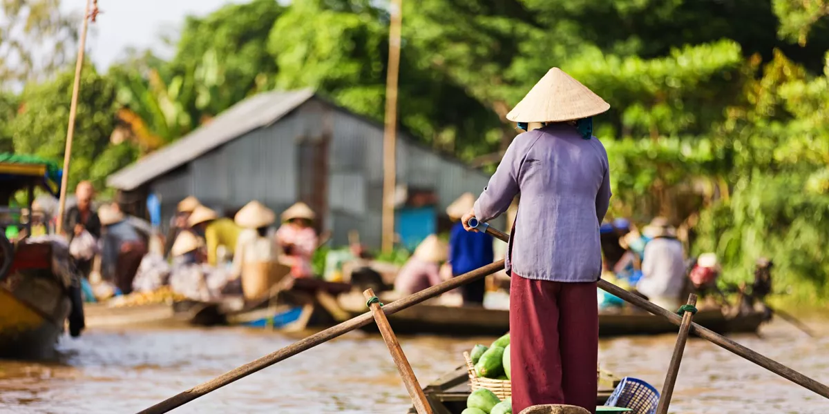 Vietnamese Woman Rowing Boat