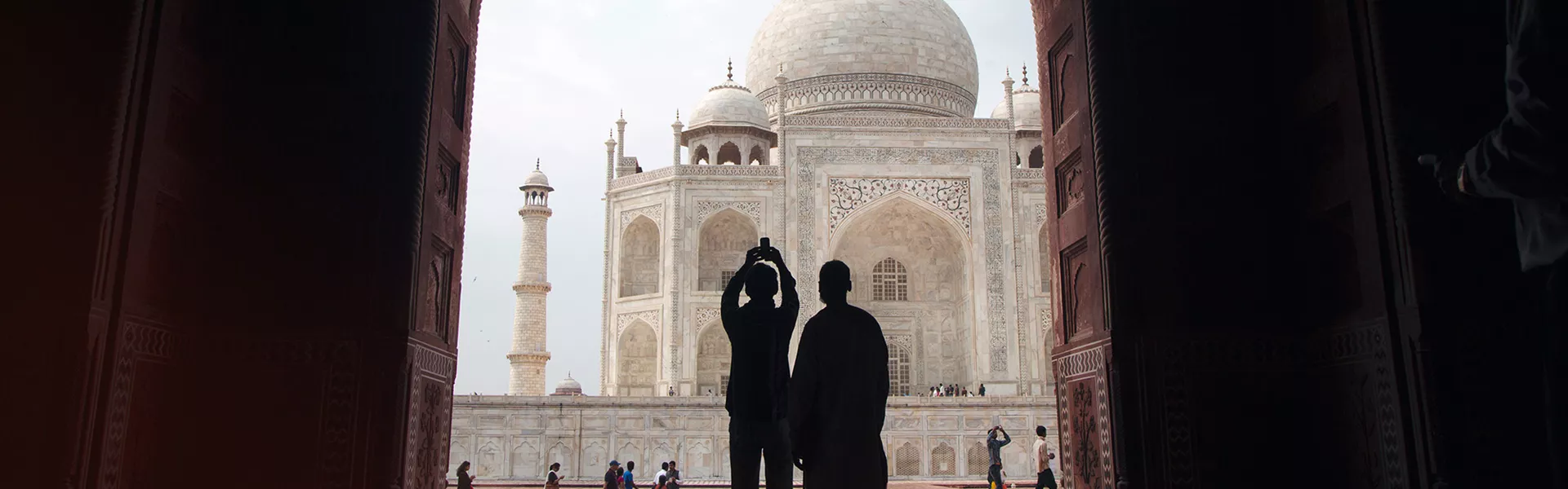 Two People Outlined in front of the Taj Mahal
