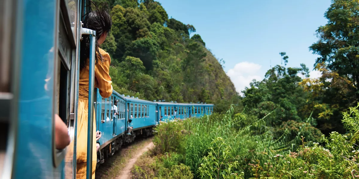 Woman taking the train ride in Sri Lanka tea plantations