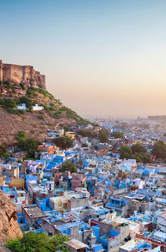 fort overlooking a city full of blue buildings