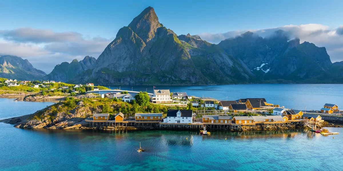 An island township surrounded by water with a mountain in the background