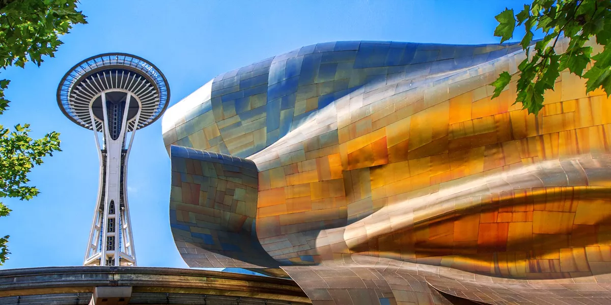View Of Space Needle, Seattle Center Monorail And Exterior Of The EMP Museum Building