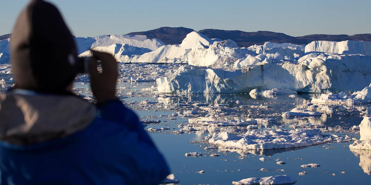 Looking Out From The Coast Of Ilulissat at icebergs