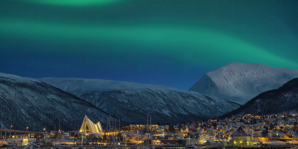 Norwegian city of Tromso captured with Northern Lights in the sky