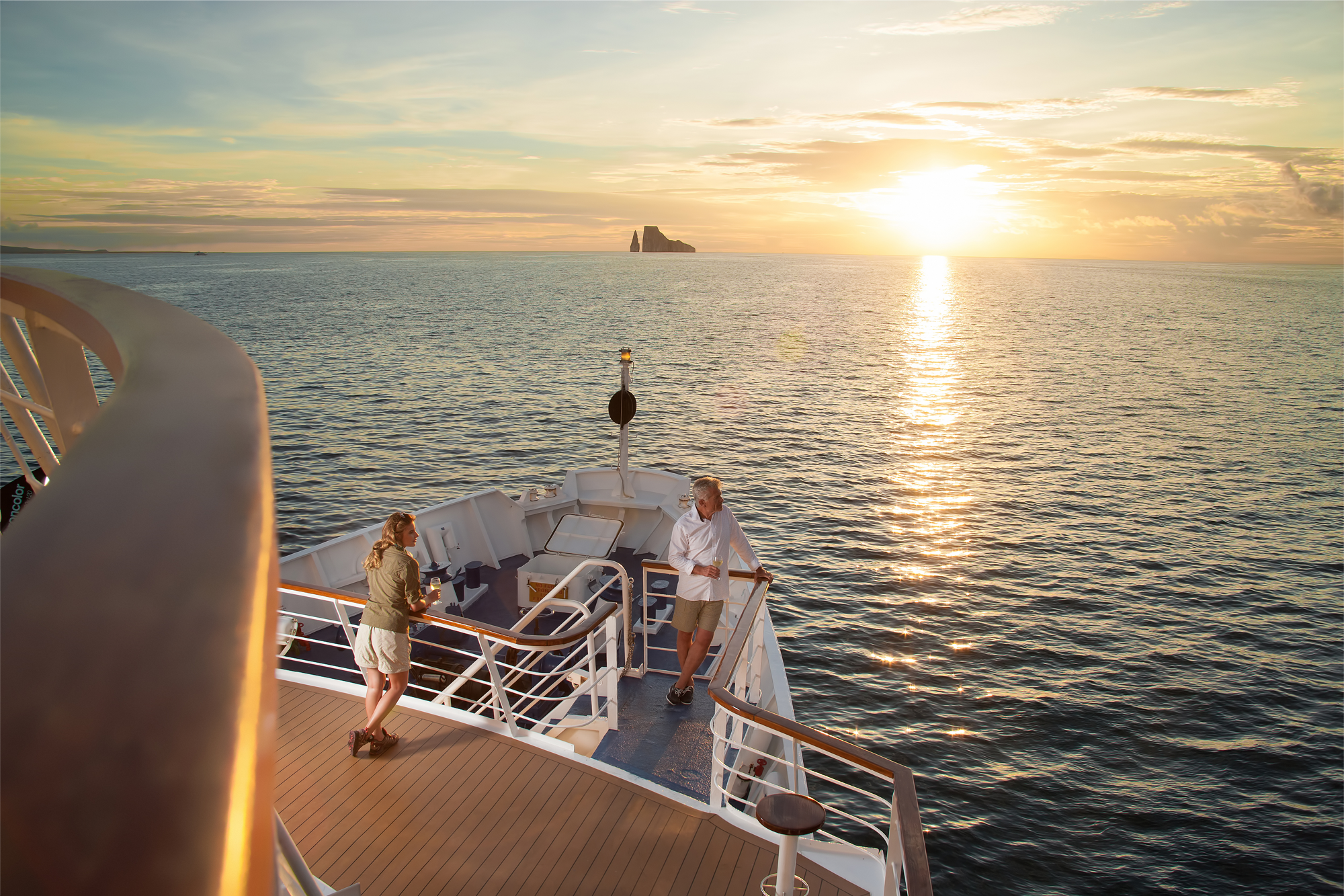 Passengers on the bow of a yacht