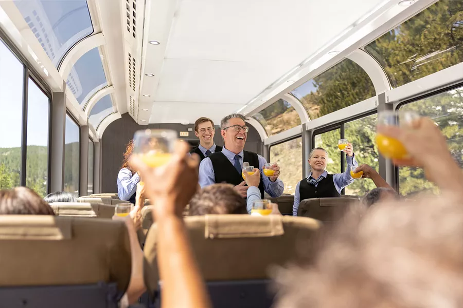 people cheering on a domeroof train