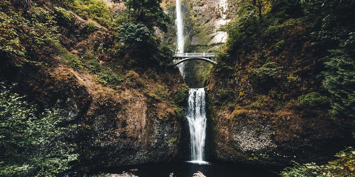 bridge across a waterfall